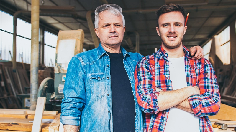 Two male woodworkers in their shop.